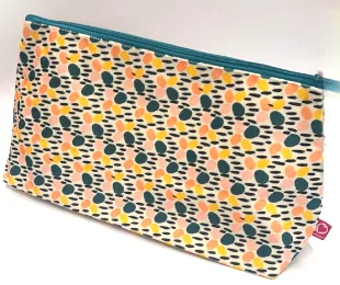 Trousse en tissu à pois de couleur, vendue par la boutique